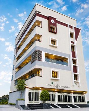 SLS HOMESTAY - Luxury AC Service Apartments 1BHK, 2BHK, 3BHK - Direct Flyover to Alipiri Tirumala Gate - Walk to PS4 Pure Veg Restaurants, Supermarkets - Near to National Highway & Padmavathi Amma Temple - Modular Kitchen, Living room -Free Superfast Wifi - Housity