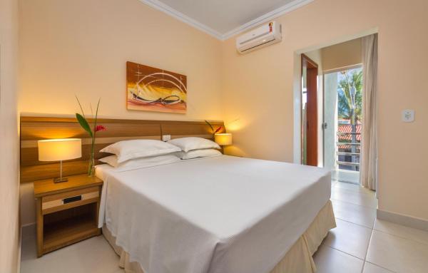 Cama o camas de una habitación en Vitoria Regia Praia Hotel