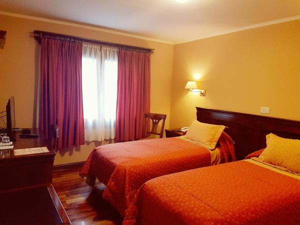 Cama o camas de una habitación en Patagonia Queen Hotel Boutique