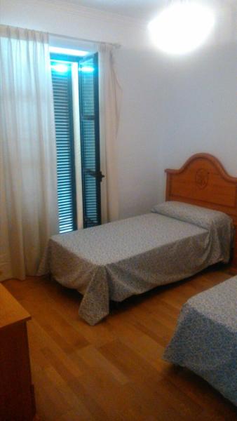 Cama o camas de una habitación en Apartamentos Porvera Jerez