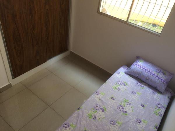 Cama o camas de una habitación en Excelente apartamento em Belo Horizonte