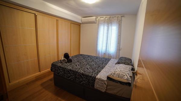 Cama o camas de una habitación en Apartments Madrid Eliptica