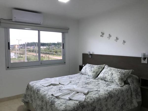 Cama o camas de una habitación en Loma Soleada Apart Hotel