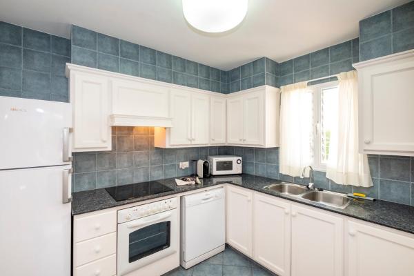 Una cocina o zona de cocina en Villas Geisan
