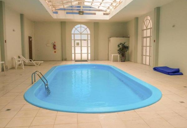 The swimming pool at or near Apartamento Classe A