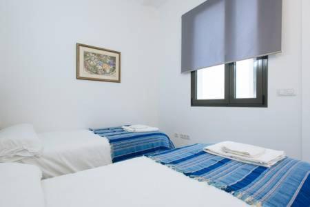 Cama o camas de una habitación en apartamento con parking Jesus del Gran Poder