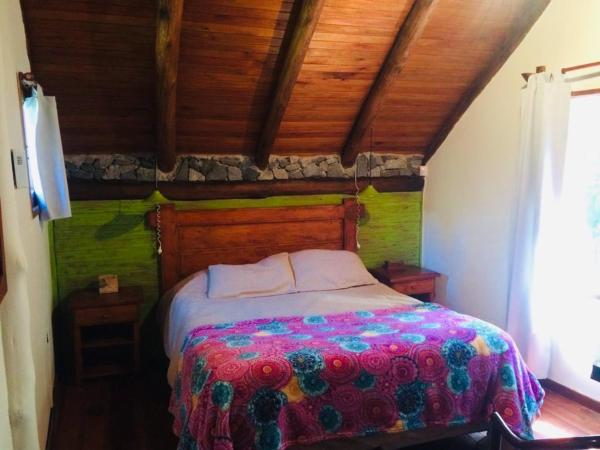 Cama o camas de una habitación en Cabañas del Bosque