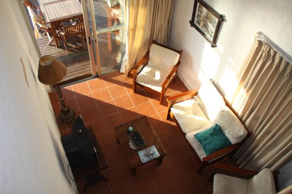 an overhead view of a living room with a couch and chair at Suite Duplex special Amarras Reales in Piriápolis