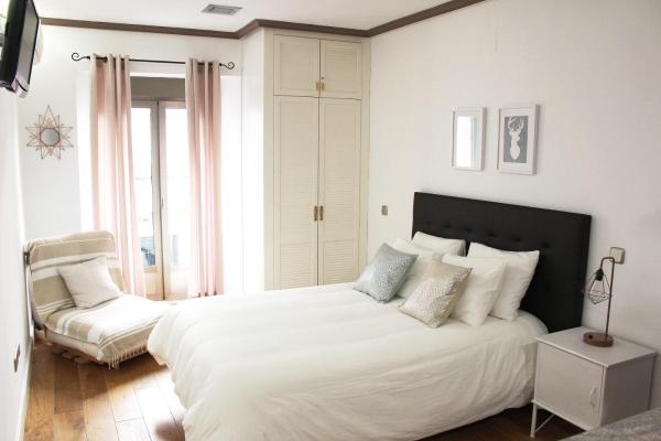 Cama o camas de una habitación en CHUECA Apartamentos
