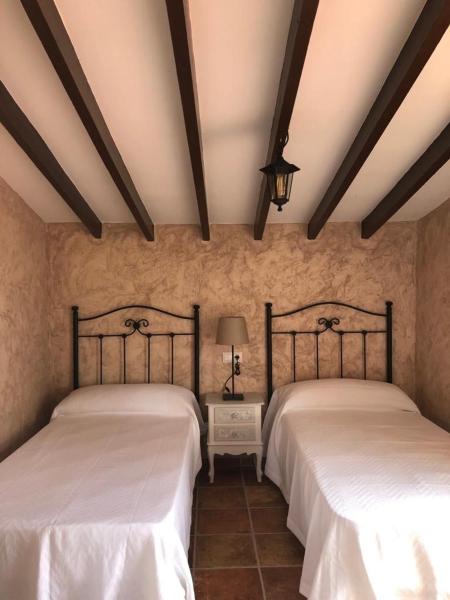 Cama o camas de una habitación en El Cortijillo