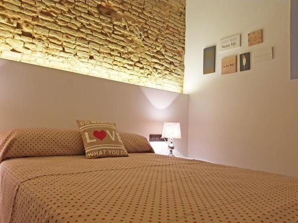 Cama o camas de una habitación en Apartamentos Granada Deluxe 3000