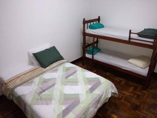 Cama o camas de una habitación en Curitiba Central Hostel