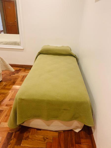 Una cama o camas en una habitación de Hotel Petit