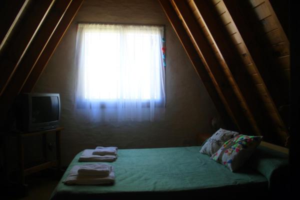 Cama o camas en una habitación de Cabañas Alpinos