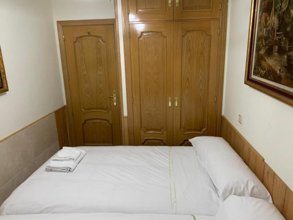 Cama o camas de una habitación en Apartamentos Suites Torr Av América - López de Hoyos