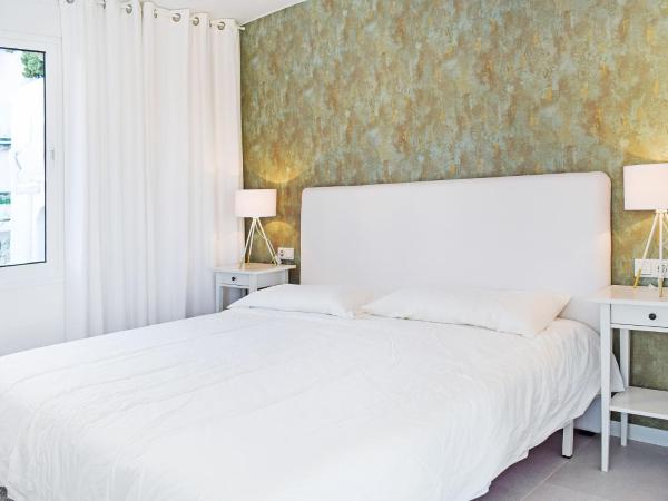Cama o camas de una habitación en Apartment Pueblo Arabesque