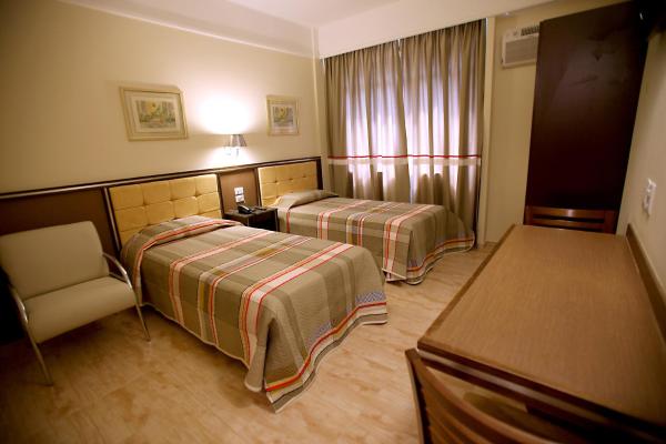 Cama o camas de una habitación en Soneca Plaza Hotel