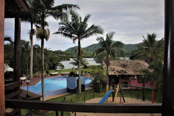 a resort with a swimming pool and a playground at Saint Germain - Lagoa da Conceição in Florianópolis
