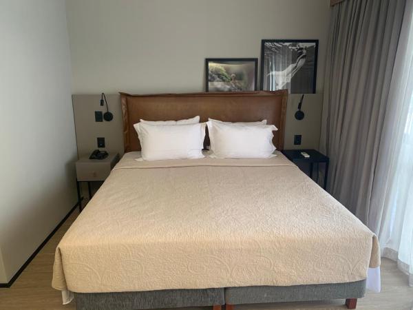 Cama o camas de una habitación en The Capital Flat - Itaim
