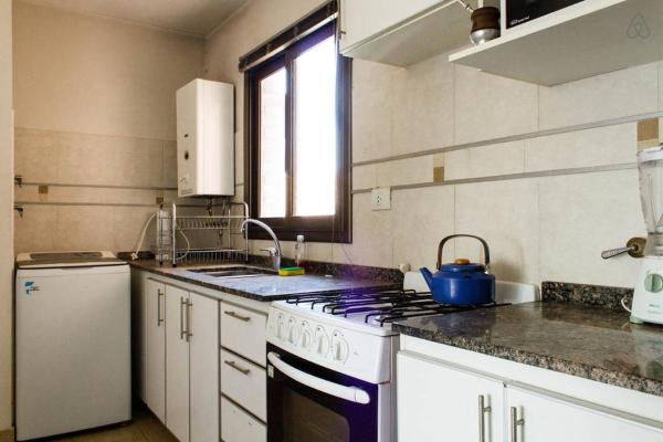 Una cocina o kitchenette en Departamento enorme en Nva Cba- Ideal familias