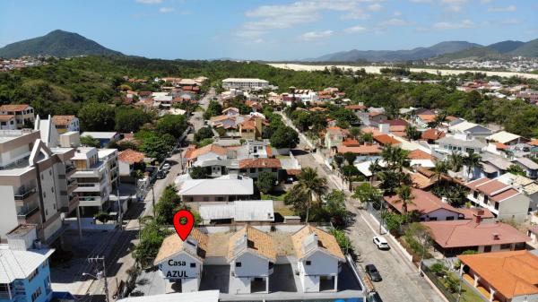 an aerial view of a town with a red marker at Casa AZUL - A 70 Metros da Areia da Praia dos Ingleses - 6 Pessoas in Florianópolis