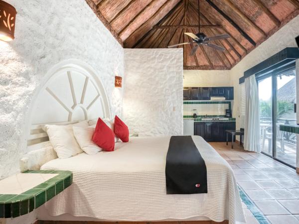 Cama o camas de una habitación en Capital O Mimi Del Mar, Playa del Carmen