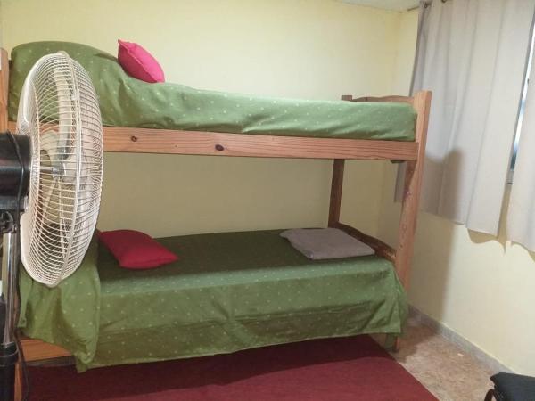 Una cama o camas cuchetas en una habitación  de MT Verde Barrio Jardín