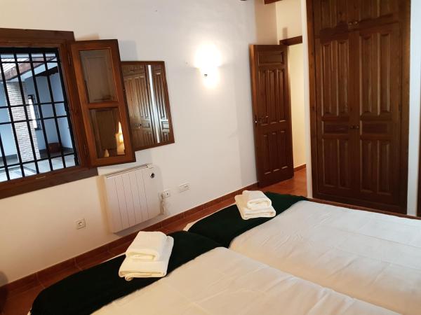 Cama o camas de una habitación en El Rey Zagal apartamento Granada