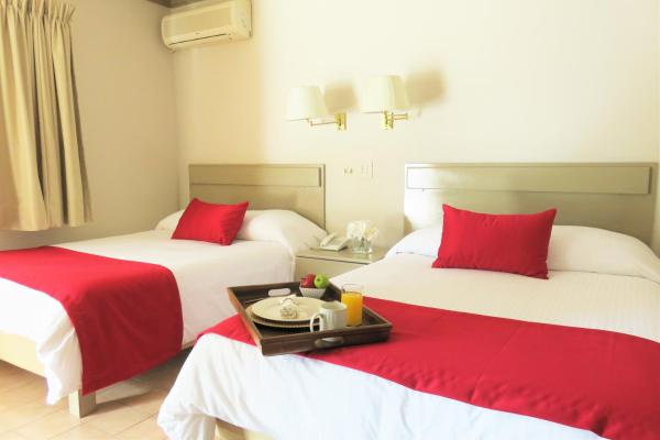 Cama o camas de una habitación en Hotel Huizache