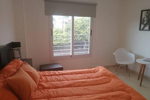 Una cama o camas en una habitación de Departamento a estrenar, amplio en Córdoba