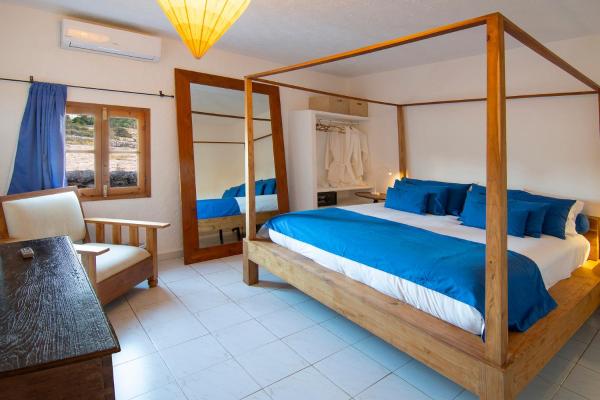 Cama o camas de una habitación en La Masia de Formentera