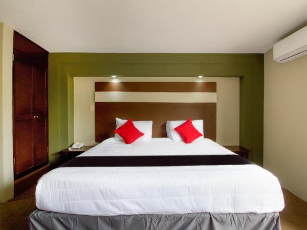 Cama o camas de una habitación en Capital O Hotel La Fuente, Saltillo