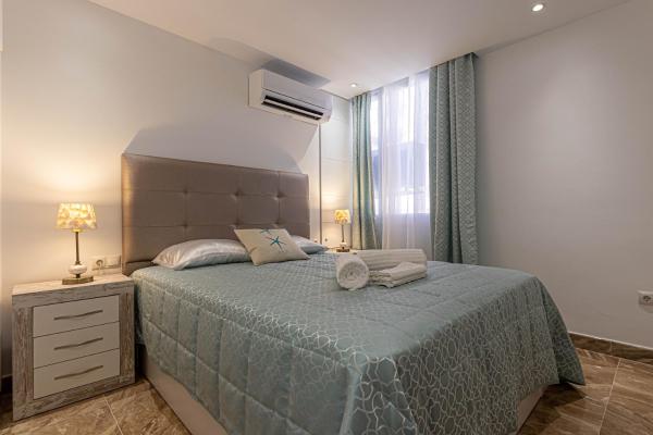 Cama o camas de una habitación en Costa Paradise - BEACHFRONT APARTMENT