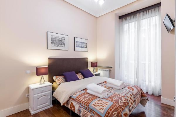 Cama o camas de una habitación en Arenal Adagio Apartment