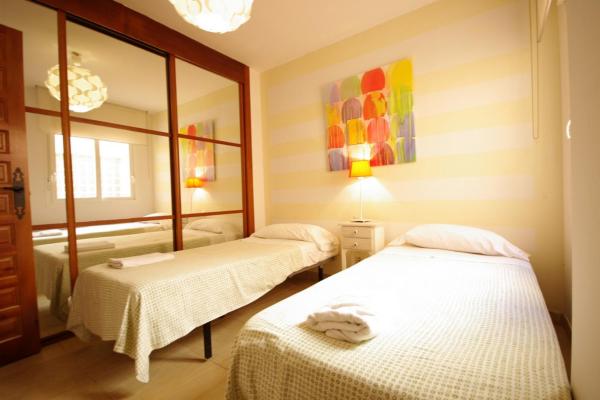 Cama o camas de una habitación en Livingtarifa Carpe Diem