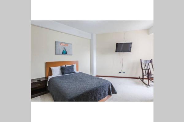 Cama o camas de una habitación en Amazing 2 bedroom Apartment Zona 14