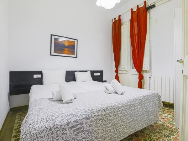 Cama o camas de una habitación en Cordero barcelona arco del triunfo sunny colores
