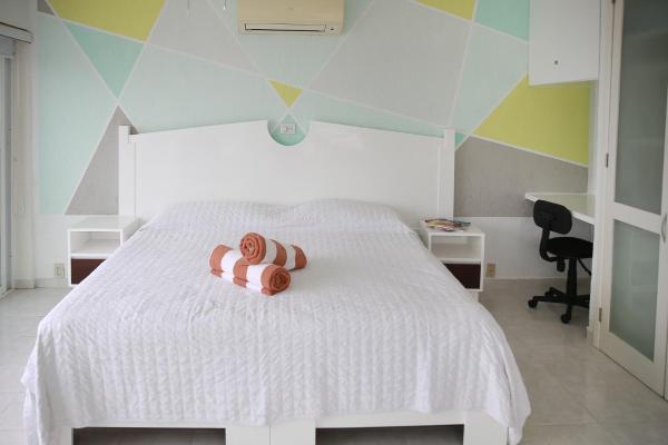Cama o camas de una habitación en 01 Ocean View Terrace cozy 1 bdrm apartment Beach Front Brisas Cancún Zona Hotelera