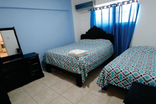 Cama o camas de una habitación en Hostal Magisterial Santo Domingo