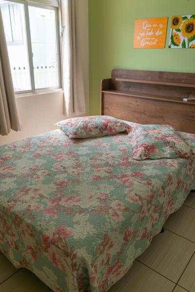Cama o camas de una habitación en Edifício Iris - Bombinhas