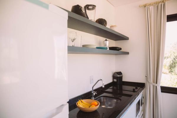 A kitchen or kitchenette at VillaRosa Aparts