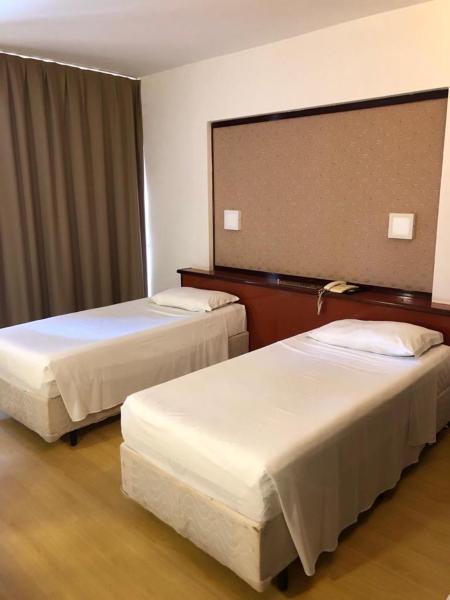 Cama o camas de una habitación en Apart Hotel no Coração de Brasília Kubitschek Plaza