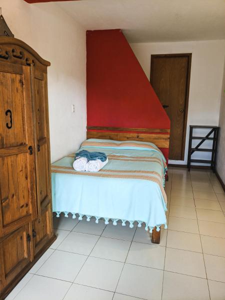 Cama o camas de una habitación en La Abuelita Hostal