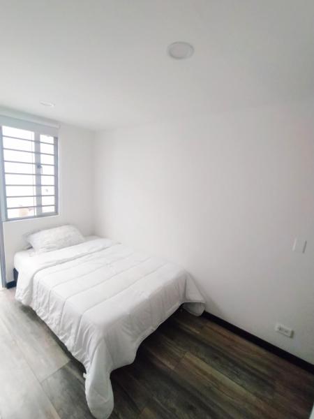 Cama o camas de una habitación en 7 Apartamento dos habitaciones Cedritos Minimalista