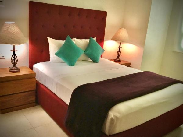 Cama o camas de una habitación en Apartamentos Grand Venetian Puerto Vallarta