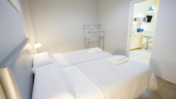 Cama o camas de una habitación en Deluxe Apartment in La Giralda