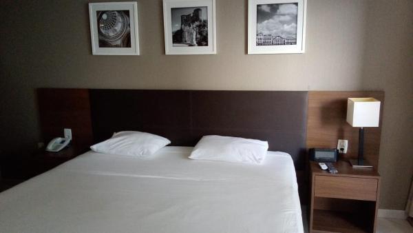 Cama o camas en habitación en Flat Recife Av Boa Viagem- Beach Class Internacional