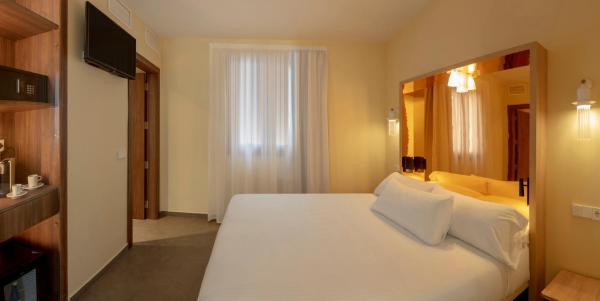 Cama o camas de una habitación en SH Suite Palace
