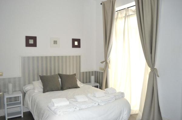 Cama o camas de una habitación en Casas y Patios de Sevilla
