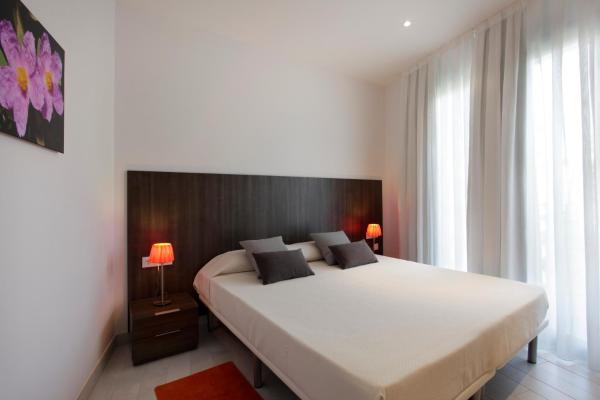 Cama o camas de una habitación en Fisa Rentals Les Corts Apartments